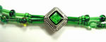 silver and green bead